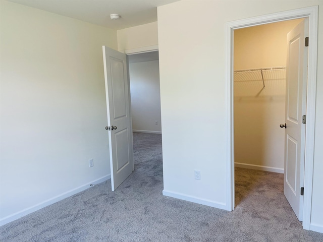 135 Hunter Ridge Dr, Boiling Springs, SC 29316 - unfurnished bedroom featuring carpet floors, a walk in closet, and a closet