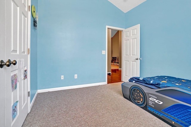711 Waxwing Ct, Boiling Springs, SC 29316 - carpeted bedroom with vaulted ceiling and baseboards