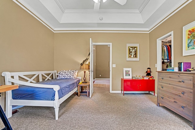 711 Waxwing Ct, Boiling Springs, SC 29316 - carpeted bedroom featuring a tray ceiling, ornamental molding, a ceiling fan, and a walk in closet