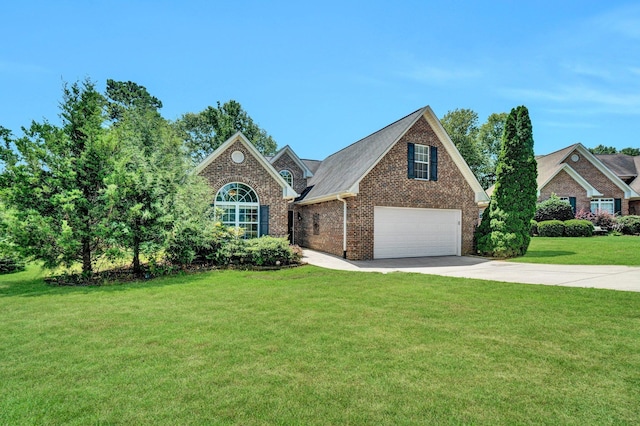 711 Waxwing Ct, Boiling Springs, SC 29316 - view of front of property with concrete driveway, brick siding, a front lawn, and an attached garage