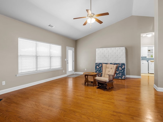 612 Hedgeapple Ln, Lyman, SC 29365 - sitting room with washing machine and clothes dryer, a ceiling fan, wood finished floors, and high vaulted ceiling