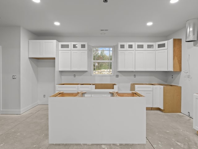 278 Forest Ave, Landrum, SC 29356 - kitchen featuring a kitchen island, concrete floors, white cabinetry, and recessed lighting