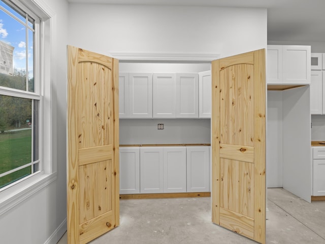 278 Forest Ave, Landrum, SC 29356 - unfurnished bedroom with unfinished concrete floors
