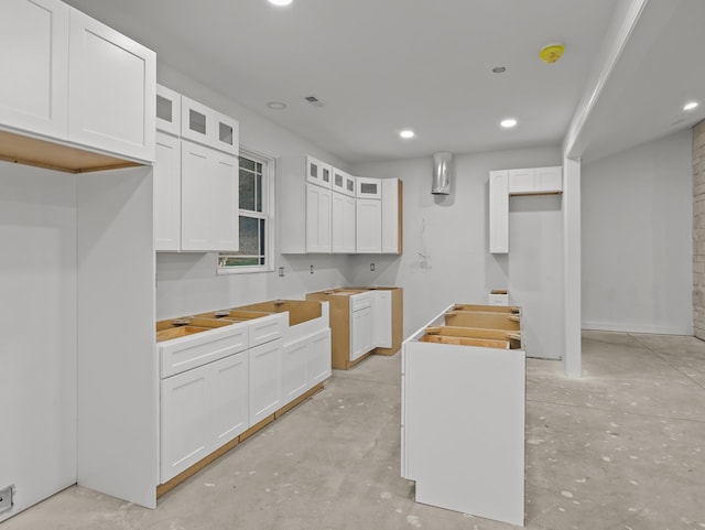 278 Forest Ave, Landrum, SC 29356 - kitchen featuring concrete floors, glass insert cabinets, recessed lighting, and white cabinets