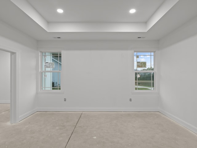 278 Forest Ave, Landrum, SC 29356 - spare room featuring a raised ceiling, concrete flooring, and recessed lighting
