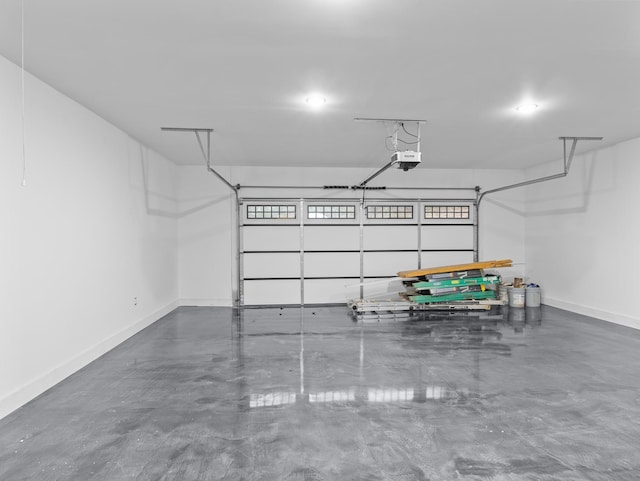 278 Forest Ave, Landrum, SC 29356 - garage with baseboards and a garage door opener