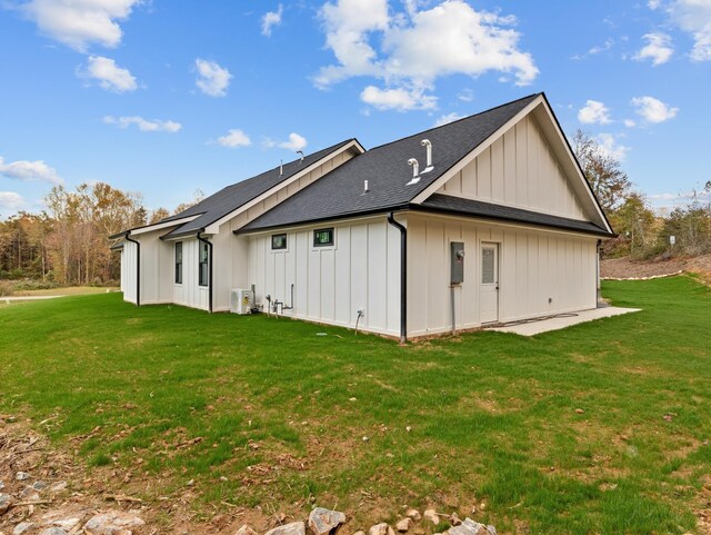 278 Forest Ave, Landrum, SC 29356 - back of property with board and batten siding, a yard, and roof with shingles