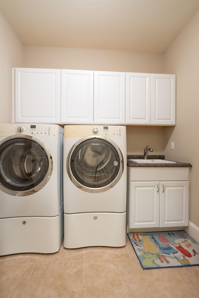 110 Coal Creek Dr, Boiling Springs, SC 29316 - laundry area with cabinet space, washer and dryer, and light tile patterned floors