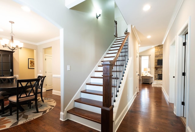 110 Coal Creek Dr, Boiling Springs, SC 29316 - stairway featuring a stone fireplace, ornamental molding, wood finished floors, a chandelier, and recessed lighting