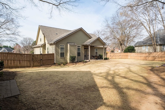 110 Coal Creek Dr, Boiling Springs, SC 29316 - rear view of property featuring a fenced backyard, a patio, roof with shingles, and a gate