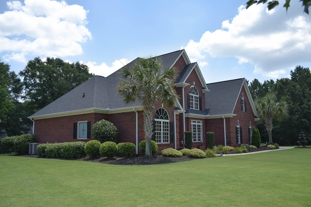 103 Welborn Oaks Way, Anderson, SC 29621 - view of side of property featuring brick siding, a lawn, and a shingled roof