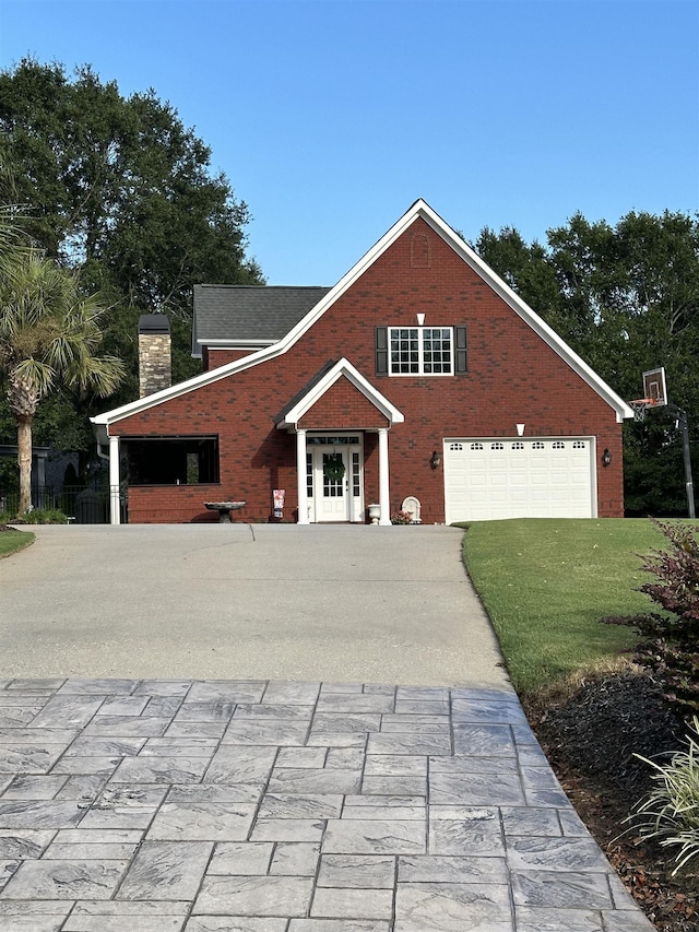 103 Welborn Oaks Way, Anderson, SC 29621 - traditional-style house with driveway, an attached garage, a chimney, and brick siding