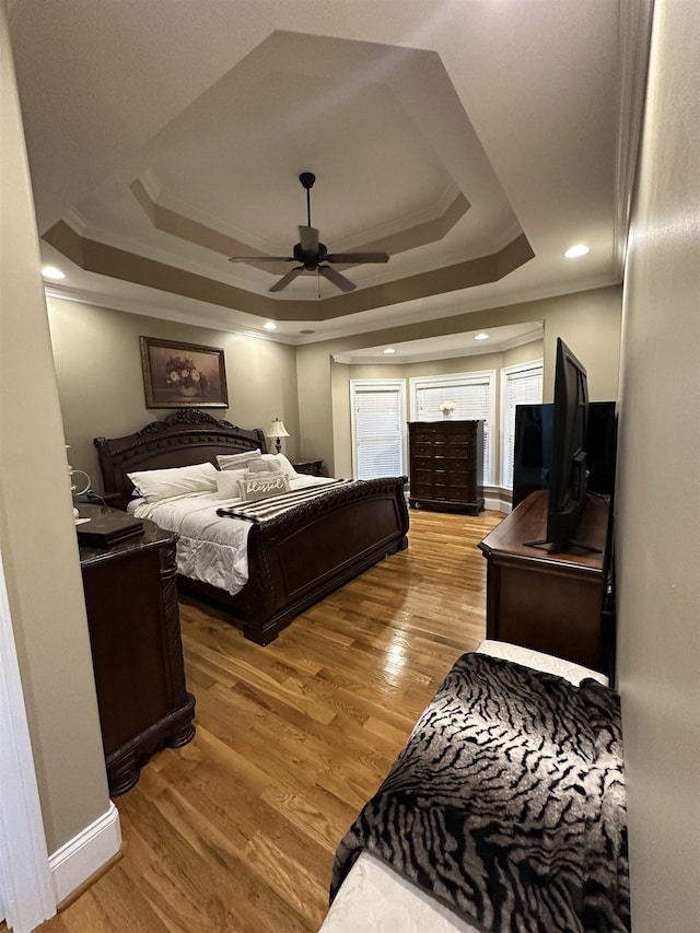 103 Welborn Oaks Way, Anderson, SC 29621 - bedroom featuring a raised ceiling, ornamental molding, light wood-style floors, and a ceiling fan