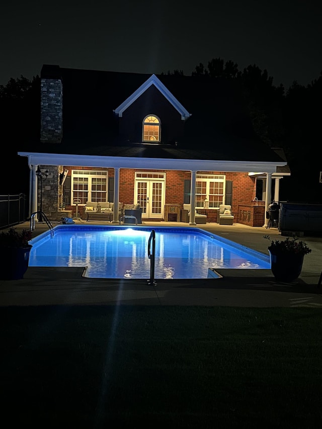 103 Welborn Oaks Way, Anderson, SC 29621 - pool at twilight featuring french doors, an outdoor pool, and a patio area