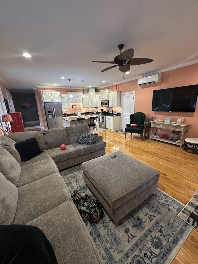 103 Welborn Oaks Way, Anderson, SC 29621 - living area with a wall mounted air conditioner, crown molding, a ceiling fan, light wood-style floors, and recessed lighting
