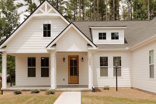 305 Meadow Tree Ct, Travelers Rest, SC 29690 - view of front of house featuring roof with shingles, board and batten siding, and a porch