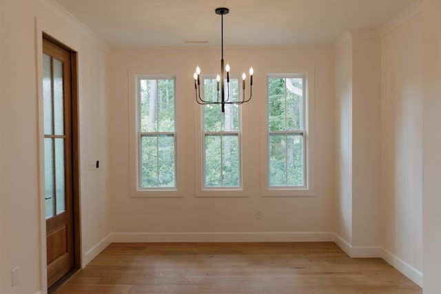305 Meadow Tree Ct, Travelers Rest, SC 29690 - unfurnished dining area featuring a chandelier, light wood-style floors, and ornamental molding