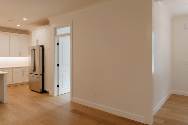 305 Meadow Tree Ct, Travelers Rest, SC 29690 - kitchen with high end fridge, crown molding, light wood-style flooring, light countertops, and white cabinets