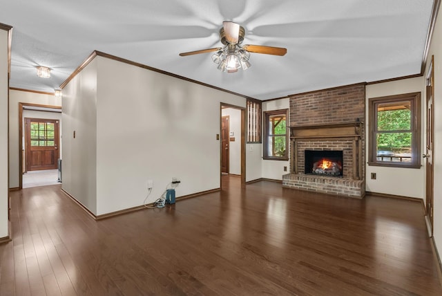 320 Whitfield Dr, Pendleton, SC 29670 - unfurnished living room with ornamental molding, ceiling fan, plenty of natural light, wood finished floors, and a brick fireplace