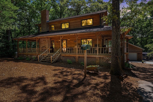 320 Whitfield Dr, Pendleton, SC 29670 - chalet / cabin with covered porch, a chimney, and a garage