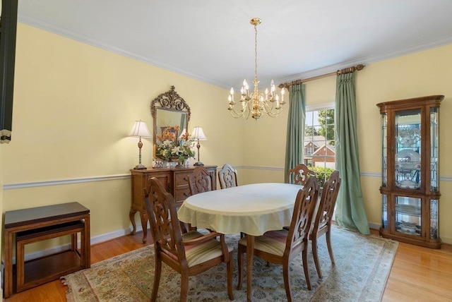 216 Antrim Ave, Moore, SC 29369 - dining area with a chandelier, crown molding, and light wood-type flooring