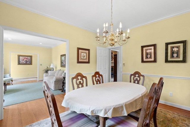 216 Antrim Ave, Moore, SC 29369 - dining space with wood finished floors, a chandelier, and crown molding
