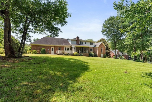 216 Antrim Ave, Moore, SC 29369 - back of house with brick siding, a yard, and a chimney