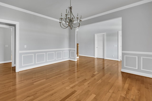 528 Carolee Way, Greer, SC 29651 - spare room featuring a chandelier, crown molding, and wood finished floors