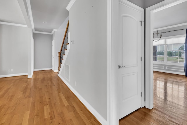 528 Carolee Way, Greer, SC 29651 - hallway featuring ornamental molding, wood finished floors, and stairway