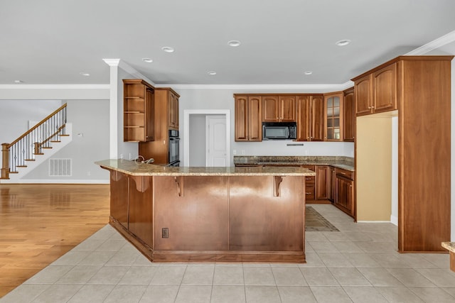 528 Carolee Way, Greer, SC 29651 - kitchen featuring black appliances, open shelves, a peninsula, light stone counters, and light tile patterned flooring