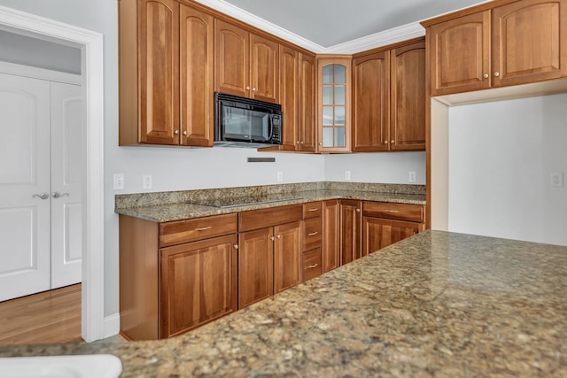 528 Carolee Way, Greer, SC 29651 - kitchen featuring black appliances, glass insert cabinets, light stone counters, and brown cabinets