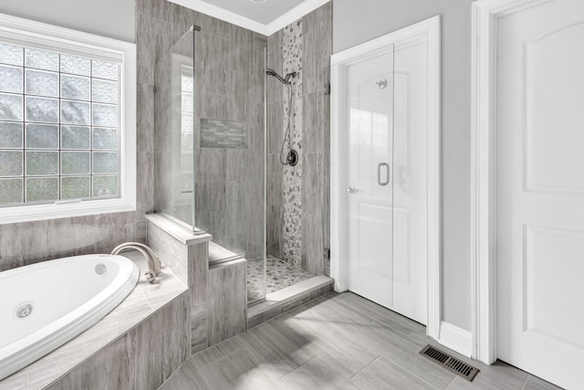 528 Carolee Way, Greer, SC 29651 - full bath with a stall shower, a garden tub, healthy amount of natural light, and tile patterned floors