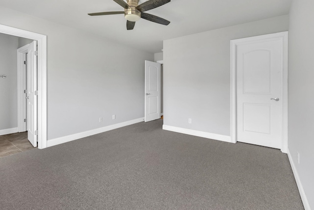 528 Carolee Way, Greer, SC 29651 - unfurnished bedroom featuring dark carpet and a ceiling fan