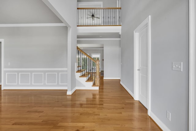 528 Carolee Way, Greer, SC 29651 - foyer featuring stairway, wood finished floors, ornamental molding, and a towering ceiling