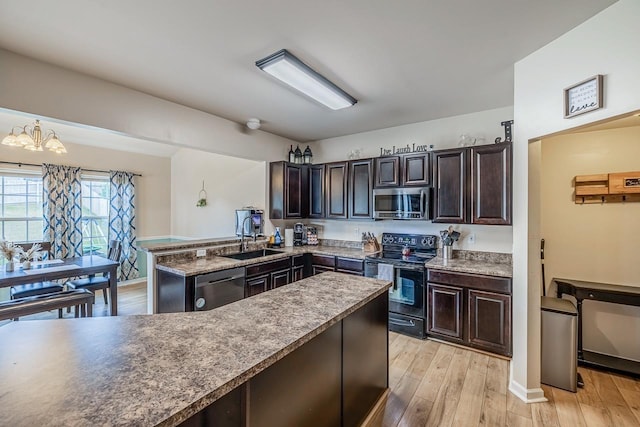 273 Bridgeport Rd, Boiling Springs, SC 29316 - kitchen with stainless steel appliances, a chandelier, and dark brown cabinetry