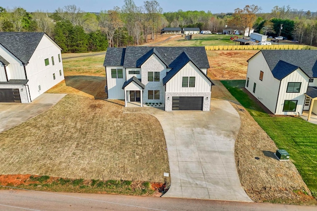 3619 Pennington Rd, Greer, SC 29651 - view of front facade with board and batten siding, an attached garage, and concrete driveway