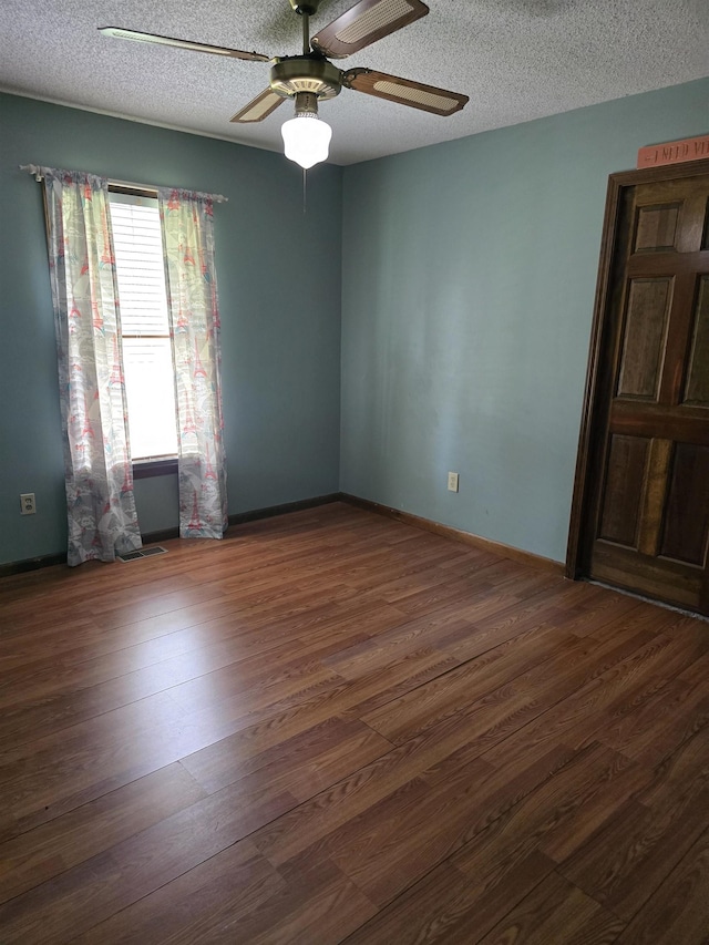 123 Sheraton Loop, Gaffney, SC 29341 - unfurnished room featuring ceiling fan, wood finished floors, and a textured ceiling