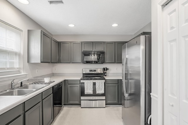620 Thornbird Cir, Boiling Springs, SC 29316 - kitchen featuring black appliances, gray cabinetry, light countertops, light floors, and recessed lighting