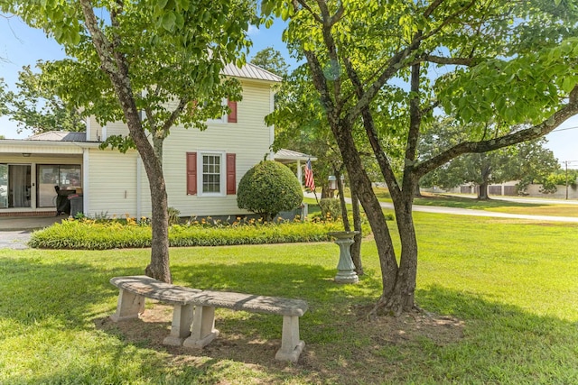 601 Front St, Chesnee, SC 29523 - view of front of house with a front lawn, a metal roof, and a standing seam roof