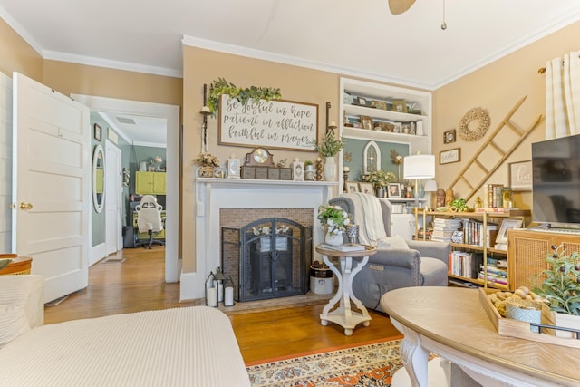 601 Front St, Chesnee, SC 29523 - living area featuring crown molding, wood finished floors, and a fireplace