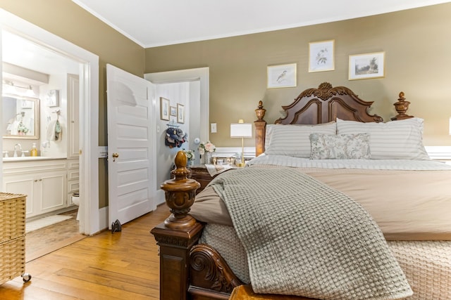 601 Front St, Chesnee, SC 29523 - bedroom with light wood finished floors, ornamental molding, and connected bathroom