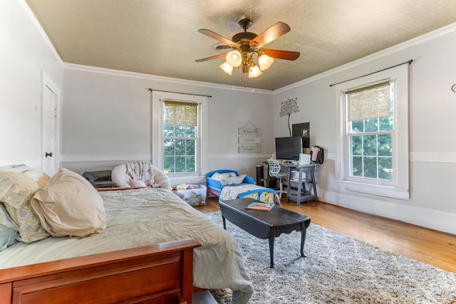 601 Front St, Chesnee, SC 29523 - bedroom with wood finished floors, ornamental molding, and a ceiling fan