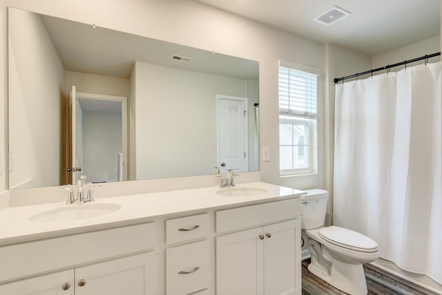 210 Wakelon Dr, Greer, SC 29651 - bathroom with double vanity, wood finished floors, and a shower with shower curtain