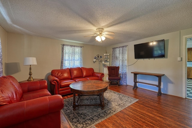 1212 Riveroak Rd, Inman, SC 29349 - living room featuring ceiling fan, wood finished floors, and a textured ceiling