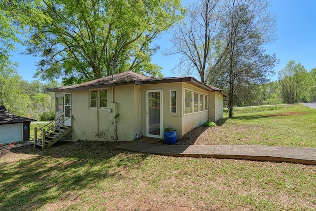 1212 Riveroak Rd, Inman, SC 29349 - back of property with stucco siding, a yard, and entry steps