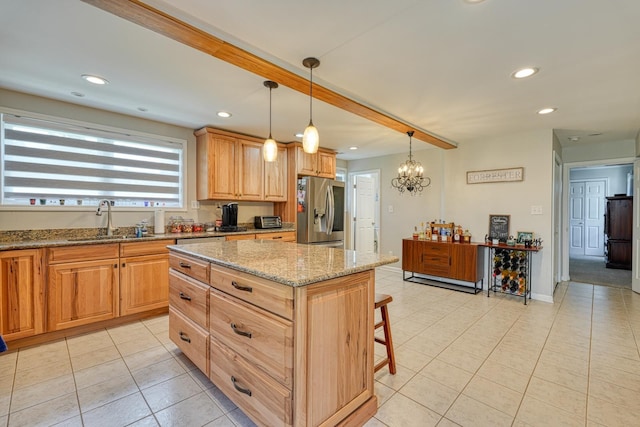 454 Chapman Dr, Inman, SC 29349 - kitchen with stainless steel fridge with ice dispenser, light tile patterned flooring, a kitchen bar, light stone countertops, and recessed lighting