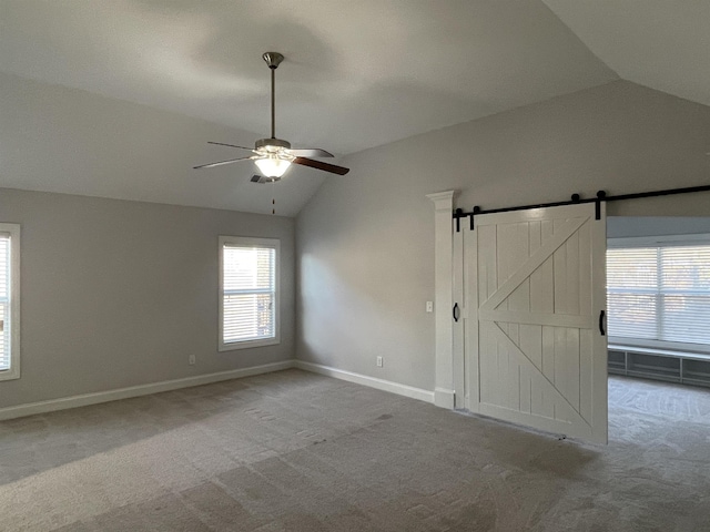 499 Gorham Dr, Boiling Springs, SC 29316 - unfurnished bedroom featuring lofted ceiling, carpet floors, a barn door, and ceiling fan