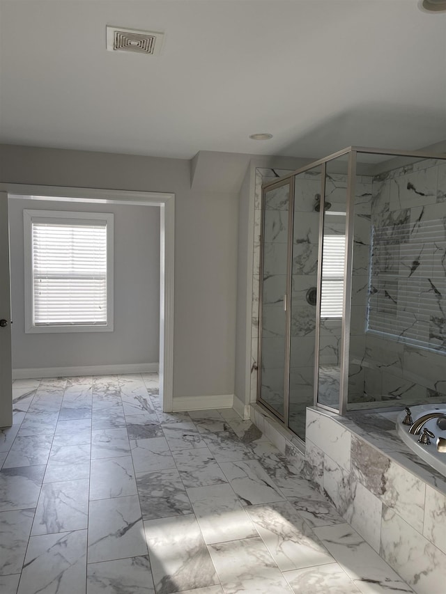 499 Gorham Dr, Boiling Springs, SC 29316 - bathroom featuring a marble finish shower, a tub with marble appearance, and marble look tiles