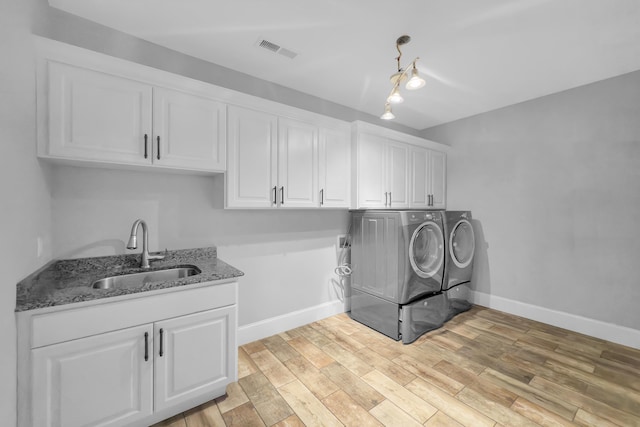 498 Double Bridge Rd, Boiling Springs, SC 29316 - laundry room with independent washer and dryer, cabinet space, and light wood finished floors