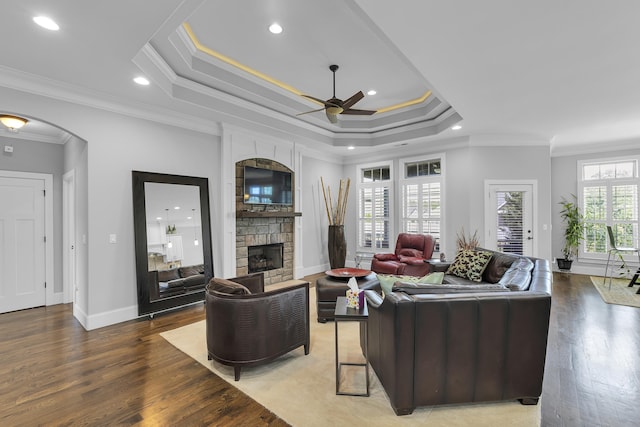 498 Double Bridge Rd, Boiling Springs, SC 29316 - living room featuring a ceiling fan, a fireplace, wood finished floors, crown molding, and a tray ceiling